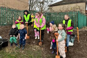 Children from Ryelands help plant fruit trees on the estate.