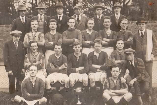 Dry Dock Utd pictured in season 1923-24 winning the Parkinson Cup by defeating Kendal Town 4-3.Jimmy Brown is pictured kneeling to the right of the first row.
