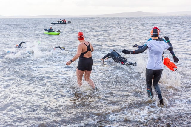 Diving into the sea for the Boxing Day Dip. Picture by Keith Douglas.