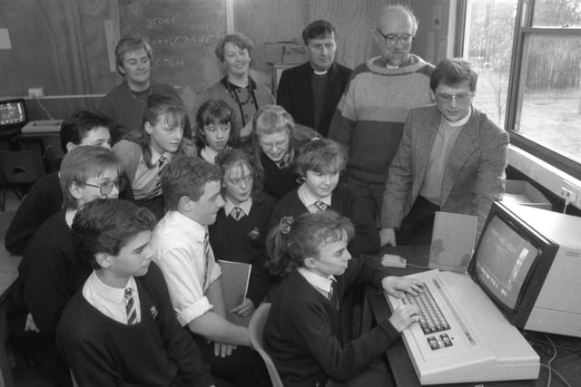 Third year pupils from Garstang High School pupils show the local clergy, Fr David Murphy, Rev Peter Yorkstone and Rev Alan Ellershaw, how they made up a booklet about local churches on their computer. The booklet gives a list of clergy at the various churches and times of services, taking in 51 churches from an area south of Lancaster to Broughton, and covering the outlying districts of Bleasdale and Pilling