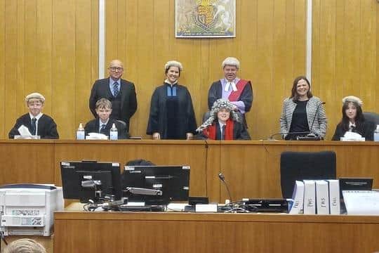 Pupils from St Bede's High School, Blackburn, take a break from their mock trial at Preston Magistrates' Court to meet, from left: circuit judge HHJ Simon Burrows, District Tribunal Judge Jennifer McDade, circuit judge HHJ Darren Preston and District Judge Joanne Cronshaw.