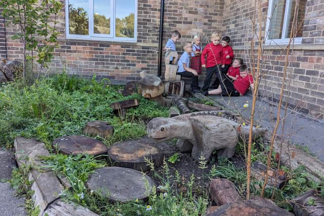 Youngsters relax in their school garden.