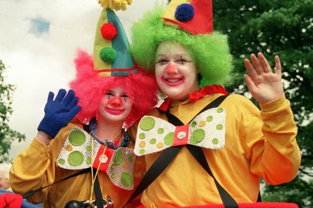 Churchtown Festival clowns, Jenna Russell and Rachel Witte, aged 13, add a splash of colour to the procession