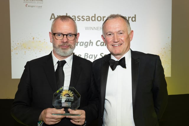 Ambassador Award winner Daragh Carville (left) receives his award from Stephen Wright, director of Wright & Lord Solicitors.