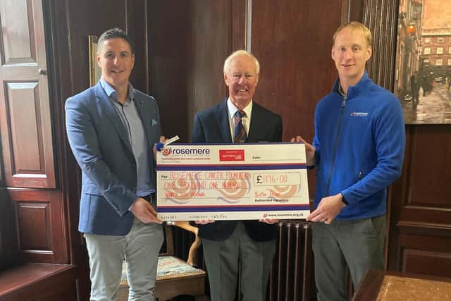 Michael Burton (left), of event sponsors Burton & Fisher Financial Services, and Trevor Bentley (centre), of Morecambe Golf Club, present Dan Hill, of Rosemere Cancer Foundation, with the golf day donation for the charity’s Guiding Light Appeal.