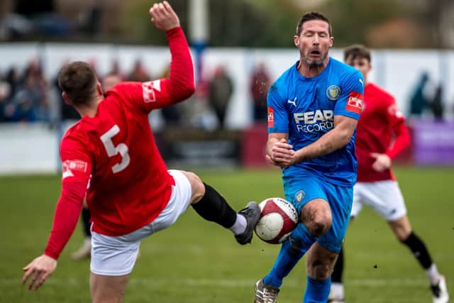 David Norris in the thick of the action against FC United