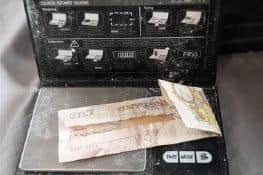 £30,000 in cash and digital scales were found at the property.