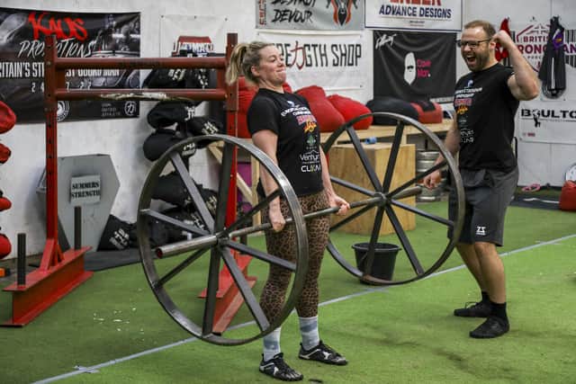 Strongman and strongwoman competitors who were both crowned European champs on the same day, Josh with his partner Molly at their gym, the Lean Body Strength Club in Morecambe. Photo: SWNS