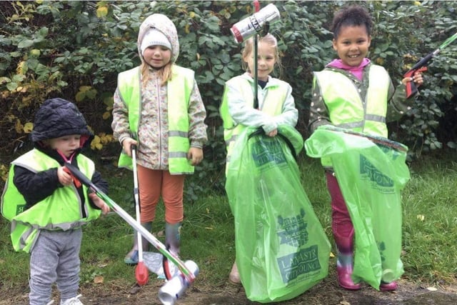These four children took part in a Halloween litter pick and collected bags of rubbish.