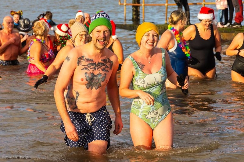 Coming out of the sea happy and smiling after the New Year's Day Dip in Morecambe Bay for the hospice.
