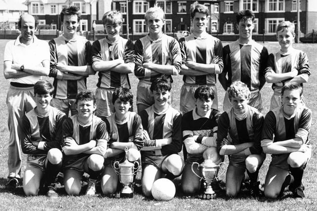 Fleetwood High School Under 15s soccer team, the winners of the Jim Tolson Cup for the under 15s champions of Lancashire. Standing (from left): Mr P Fenwick (manager), Stephen Birks, Simon Longrigg, Jamie Bell, Phillip Bee, Paul Towne, and Neal Ellis. Front (from left): Andrew Cooper, Lee Preston, Lee Parkinson, Paul Simey, Chris Prescott, Wayne Sharp, and Marc Atkinson
