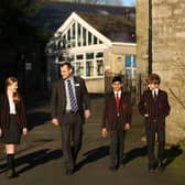 Headmaster Sam Hart with pupils at Giggleswick School in Settle. Picture: B.P.M Harris Photography