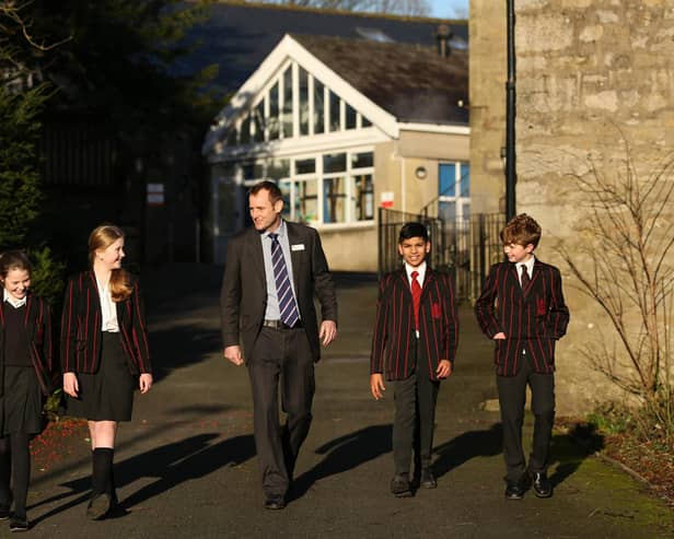 Headmaster Sam Hart with pupils at Giggleswick School in Settle. Picture: B.P.M Harris Photography