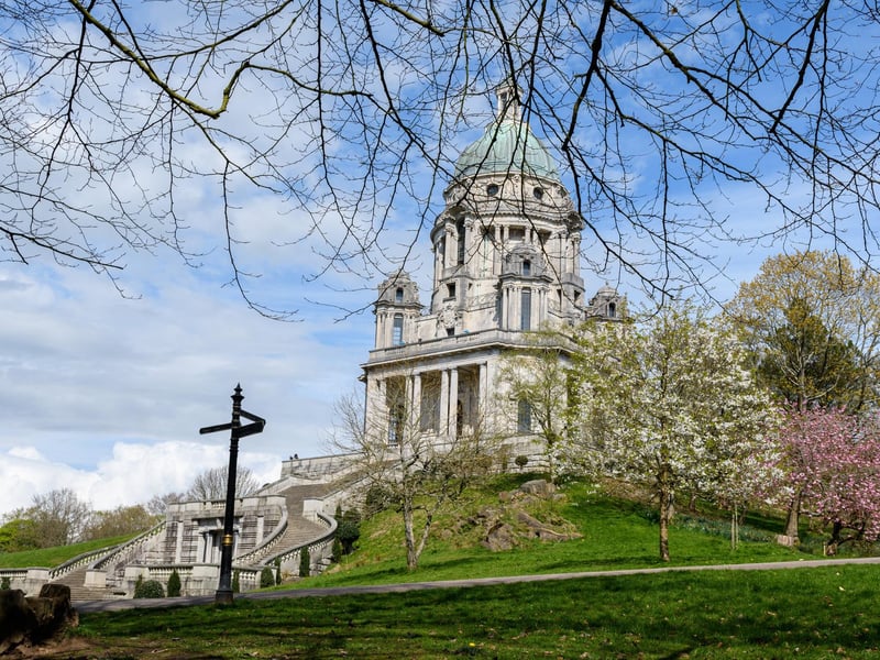 The Grade 1 listed Ashton Memorial was commissioned by Lancaster industrialist Lord Ashton as a tribute to his late wife Jessy. It was designed by John Belcher and completed in 1909. Externally, the dome is made of copper. The main construction material is Portland stone although the steps are made of Cornish granite. Around the dome are sculptures by Herbert Hampton representing Commerce, Science, Industry and Art. The interior of the dome has allegorical paintings of Commerce, Art and History by George Murray. At around 150 feet tall it dominates the Lancaster skyline. The first floor outdoor viewing gallery provides superb views of the surrounding countryside and out across Morecambe Bay to the Lakeland fells and mountains.