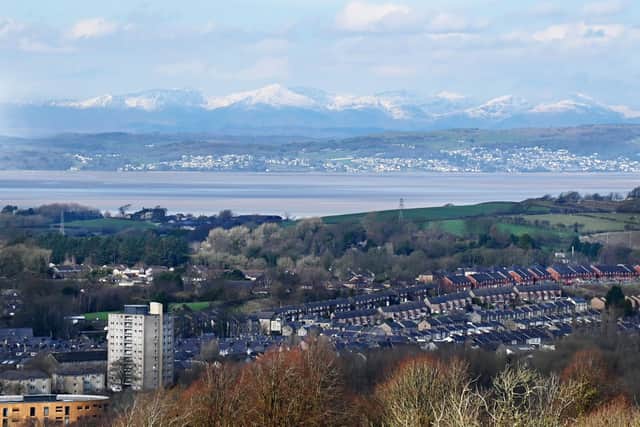 A clear spring day gives a view of Lancaster, Morecambe Bay and the Lake District from Williamson Park, Lancaster.