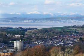 A clear spring day gives a view of Lancaster, Morecambe Bay and the Lake District from Williamson Park, Lancaster.