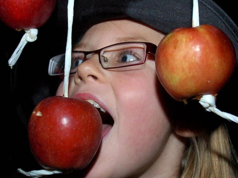 Holly Watkins-New tries apple bobbing at a Halloween party at The Gregson in Lancaster.