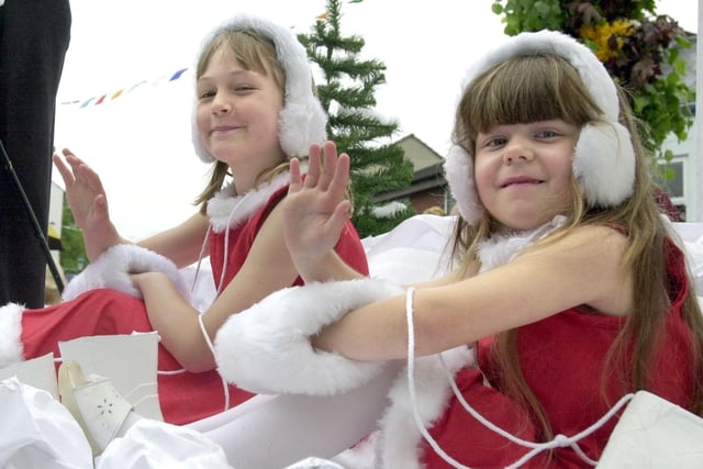A taste of winter... Nateby Primary School snow girls Rebecca Keighley, aged eight (front), and Analee Chalioner, five, on board their 'Winter Wonderland' float at Garstang Children's Festival in 2001