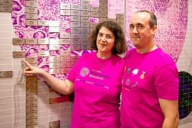 Laura and Marc Liver at the Wall of Hope, Imperial College, London.