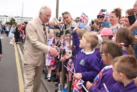 Prince Charles greets school children on Morecambe prom.
