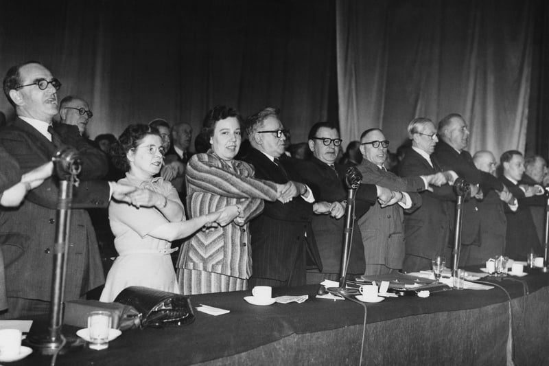 Delegates singing Auld Lang Syne at the closing of the Labour Party Conference in Morecambe in 1952. From left: Peggy Herbison (1907 - 1996), Alice Bacon, Herbert Morrison, Morgan Phillips, Harry Earnshaw and Arthur Greenwood.