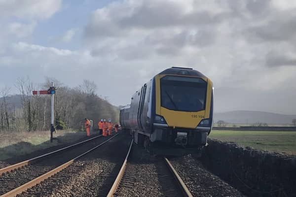 Network Rail engineers attending the site of the derailment near Grange over Sands station.