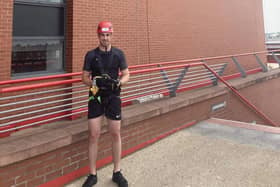 Jordan pictured at Anfield for the abseil.