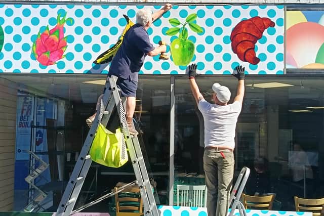 Signage goes up at the new Eggcup venue in Morecambe.