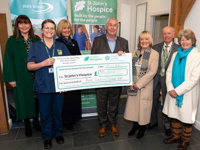 John Morphet, CEO of Pure Leisure Group, presents a cheque for £50,000 to St John's Hospice in Lancaster. Photo: Kelvin Lister-Stuttard
