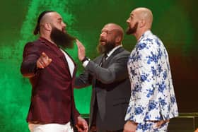 Tyson Fury with Triple H and Braun Strowman during his last WWE appearance