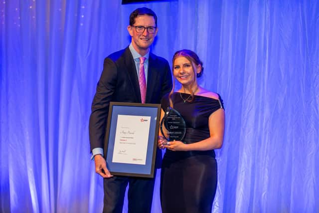 Amy Peacock accepting her award from Mark Hartley Hinkley Point C CEO.