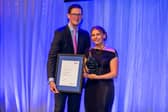 Amy Peacock accepting her award from Mark Hartley Hinkley Point C CEO.