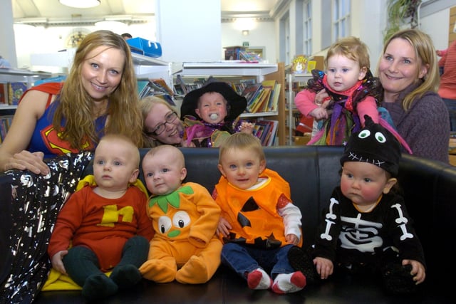 Olavg Grude, Lachlan Darragh, Isaac Shallis, Ella Muckalt and Eli Pink, Marsha Schofield, Emma and Evie Parkinson having fun at the Baby Bounce and Rhyme Halloween event held at Lancaster Library on Friday. (unknown date).