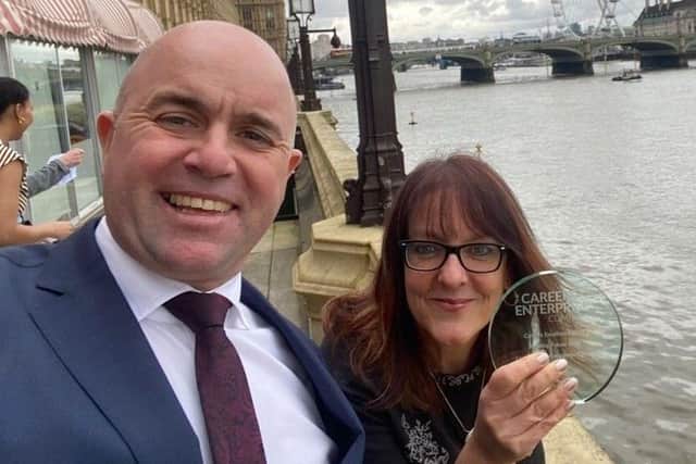 Lancaster and Morecambe College's Principal, Daniel Braithwaite, and Head of Engagement, Victoria Carter, with their award in London.