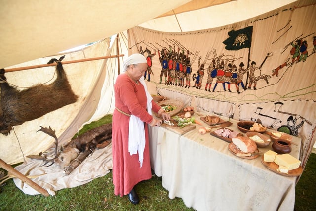 Preparing food in one of the tents at Heysham Viking Festival. Picture by Daniel Martino.