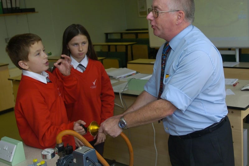 Central Lancaster High School science teacher Mr Parsons teaching Year 7 pupils Adam Lowther and Samantha McCan about air pressure using Magdeburg Hemispheres.