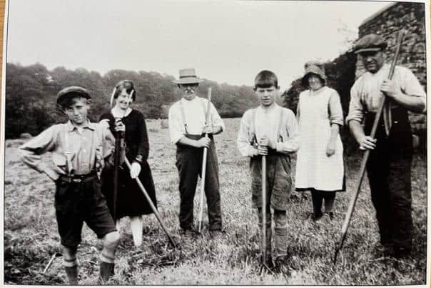 Haymaking, Pickle Meadow, Bridge House Farm, Wray c.1920. This field is now the car park for Bridge House Farm Tearooms. On the right of the photograph are the farmer Tot Stephenson and his sister Maud, who was the last local farmer to deliver milk in cans before milk bottles became universal. Picture courtesy of David Kenyon.