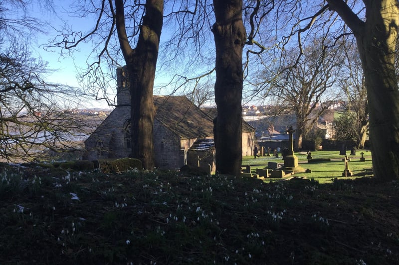 St Peter's Church at Heysham in glorious winter sunshine with the snowdrops announcing that spring is just around the corner.