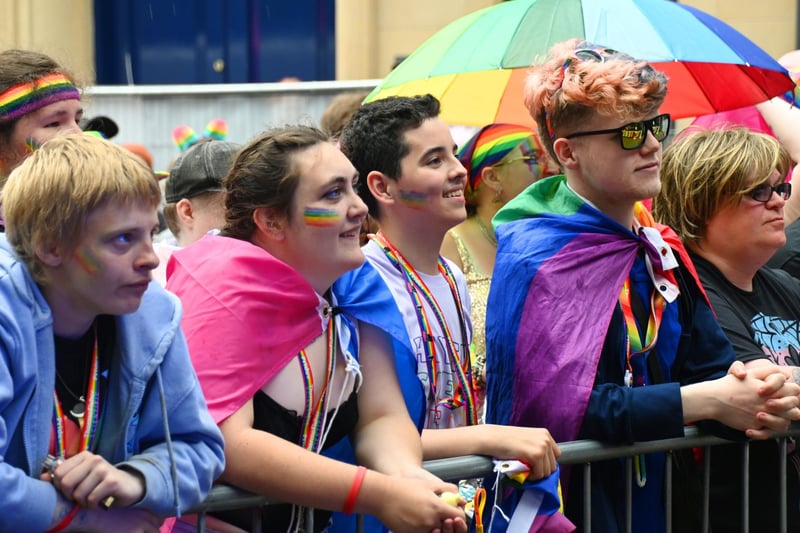 A colourful crowd has fun watching acts on stage at Lancaster Pride.