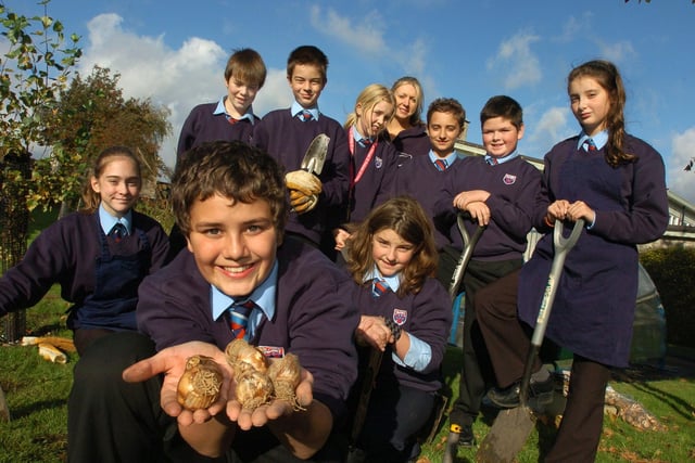 Year seven pupils at Carnforth High School, including form rep Chris Harling (front), spent time outdoors in the school grounds planting daffodil bulbs, with tools provided by Bardon Aggregates and Homebase.