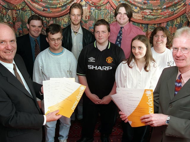 Principal of Lancaster and Morecambe College, David Roddam (left) and Brian Shannan (right), from Employment Services, present students from the college with their New Deal certificates.