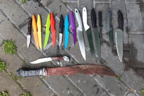 Some of the knives recovered by police from a knife bin on Central Drive in Morecambe near the skate park. Note the machete style large knife at the bottom of the picture appears to be covered in blood. Picture from Lancashire Police.