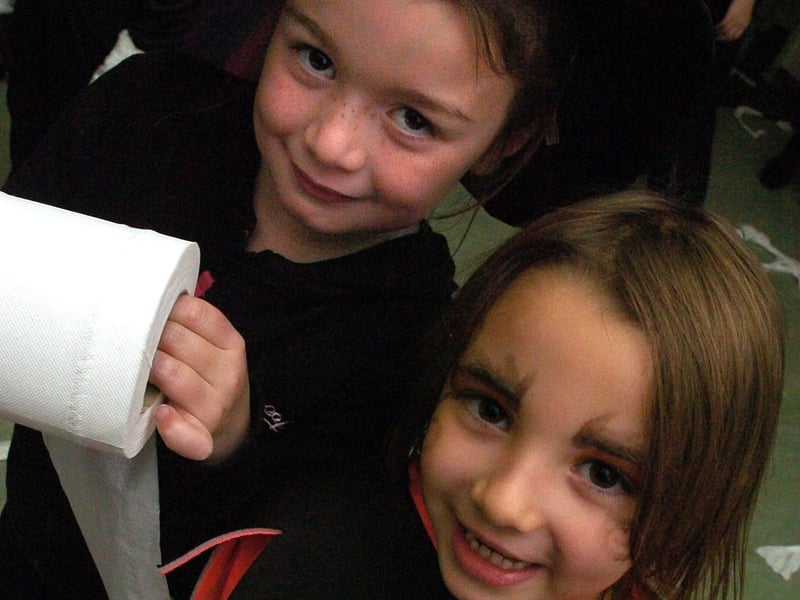 Sinead Rabbett, aged 7 (left), mummifies Shannon Gallagher (6) at Skerton Guides, Brownies and Rainbows' Halloween party held in the community centre.