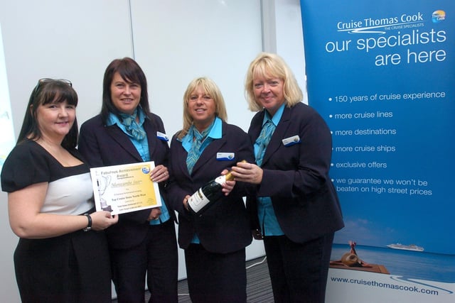 Staff at Thomas Cook's Morecambe branch, manager Joanne Hunter and cruise co-ordinator Karen Gardner, receive an achievement award from sales development executive, Mary Moscrop, for achieving top cruise sales in the North West. Also pictured is cruise co-ordinator Linda Jackson.