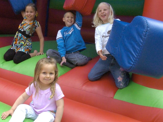 Tobias and Sarah Moller, Natasha Lee and Molly Rudkin enjoy the bouncy castle at a Grand Theatre Family Fun Day
