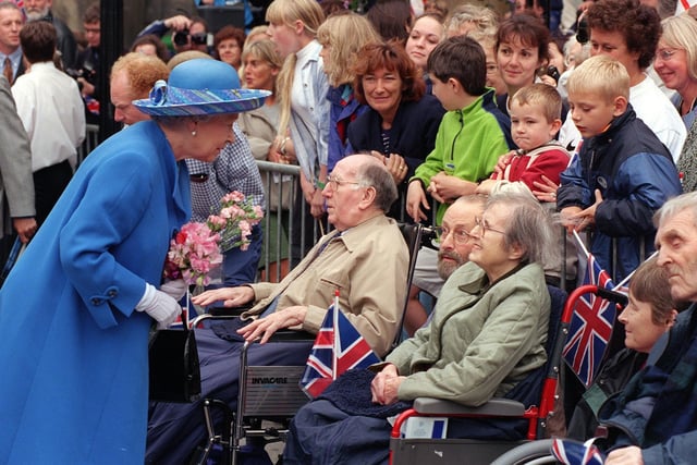 The late Queen meets the crowds in Market Street, Lancaster,, during a visit in 1999.