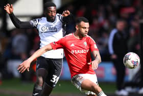Morecambe's Jordy Hiwula chases down Salford City's Curtis Tilt Picture: Ben Roberts/Getty Images