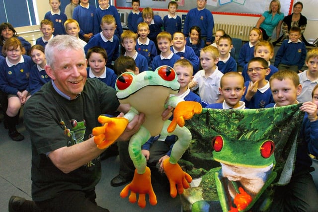 Alan Bennett during his talk at Flakefleet Primary School, Fleetwood, showing the children some of his red-eyed tree frog souvenirs from Costa Rica