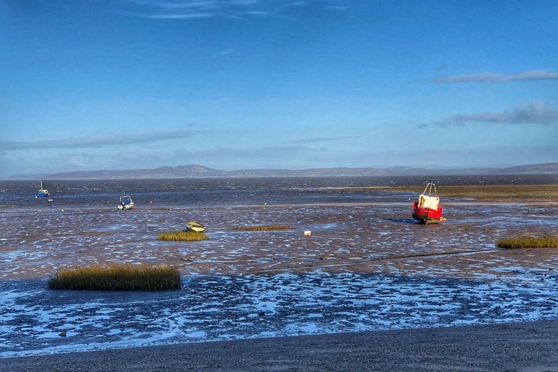 A beautiful picture of Morecambe Bay with the tide out and a view of the Lakeland Hills, which Morecambe is renowned for.