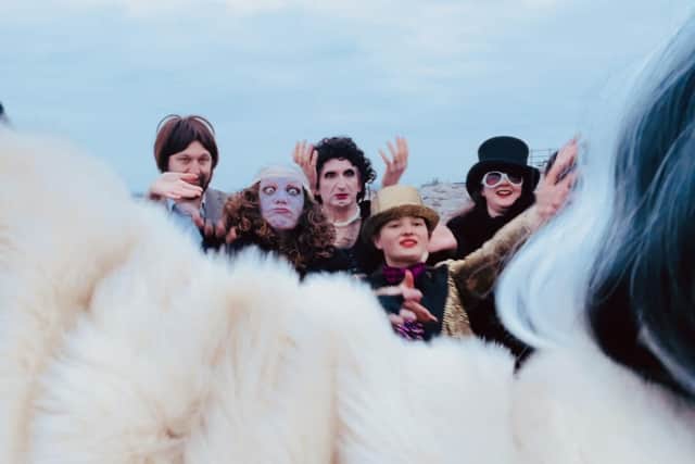 Matilda with members of the West End Players performing on Morecambe beach.